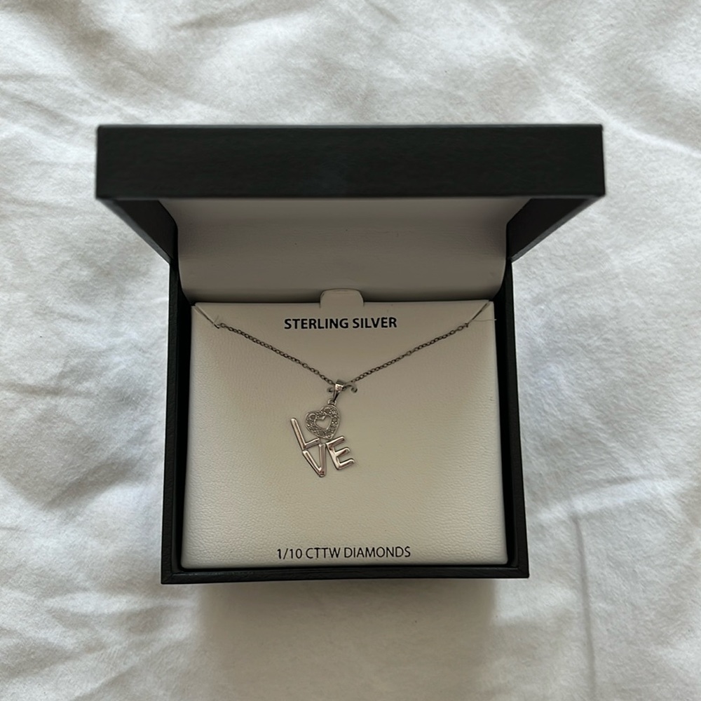 NIB love necklace.